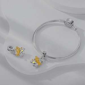 Detail of silver snake chain bracelet with golden lion charm and Family Forever engraving