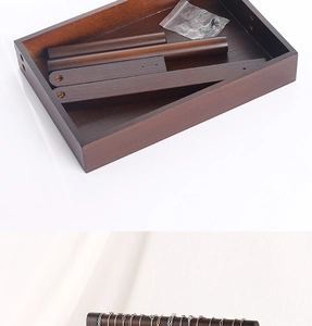 Detail view of disassembled wooden jewelry stand components and the final assembled display