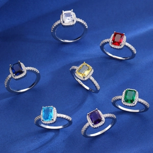 Adjustable silver heart rings set with multi-colored emerald cut stones and zircon accents