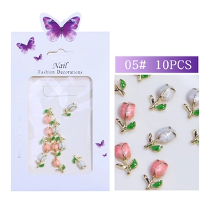 Close-up of 10PCS pink and white tulip nail charms with golden metal frames