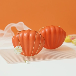 Elegant orange shell-shaped wedding candy gift box with pearl chain and Forever Love tag