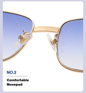 Macro shot of comfortable silicone nose pads and gold metal frame of wood grain sunglasses