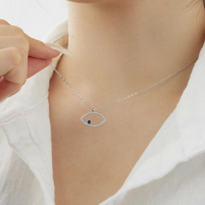 Detailed view of an S925 silver necklace with a blue eye pendant and clear zircon stones