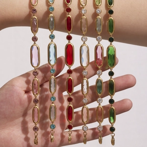 Vintage style bracelet with colorful oval stones and gold-plated geometric metal links