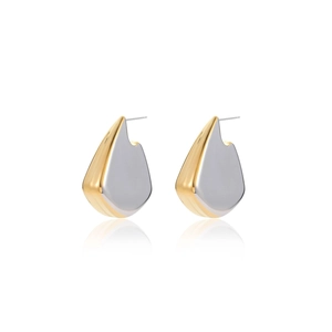 Detailed view of two-tone gold and silver irregular fin-shaped luxury hoop earrings