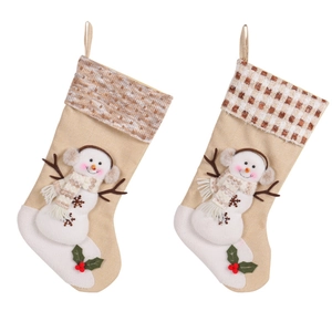 Christmas stockings featuring plush snowman character and plaid cuffs for holiday hanging decor