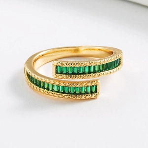 Close-up of double-layered gold ring with two rows of rectangular green zircon stones
