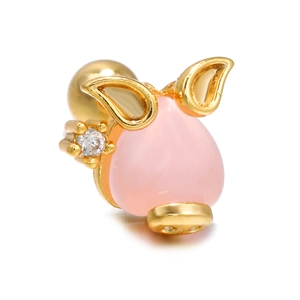 Detail of pink resin pig stud earring with gold finish and small zircon stone