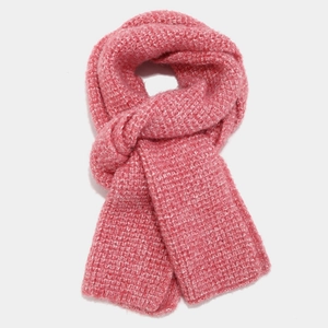 Close-up of thick pink chunky knit scarf showing warm texture and weave pattern