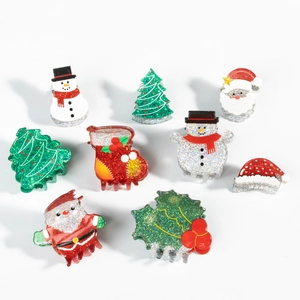 Glittery Christmas hair claw clips set featuring Santa, snowman, and tree designs