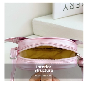 Detailed view of kids pink sequin bag with yellow lining and adjustable strap