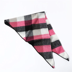 Detail of color block triangle scarf with soft faux cashmere texture and plaid pattern