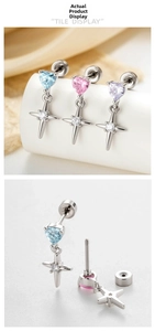 Macro view of crystal cross earrings with screw back design and vibrant heart gemstones