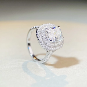 Luxurious S925 silver moissanite ring with a large square main stone and halo accents