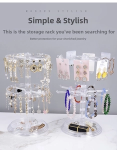 Rotating acrylic jewelry organizer featuring hooks for earrings and a base tray for rings