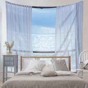 Detail of bohemian tapestry featuring a realistic window view of the blue ocean landscape