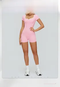 Detail view of pink yoga bodysuit with white contrast piping and sweetheart neckline