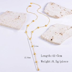 Detail of gold heart tassel necklace with length 41+5cm and weight 8.5g measurement specs