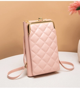 Detail view of pink quilted cell phone bag with gold hardware and kiss-lock closure