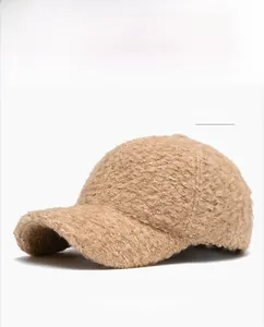 Detail of camel faux shearling baseball cap showing warm textured fabric and curved brim