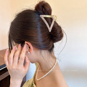 Elegant hollow triangle hair claw clip in creamy pearlescent acetate for women's updos