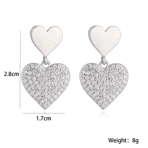 Detailed view of silver heart earrings with sparkling zircons including dimensions