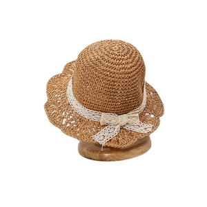 Handwoven baby girl straw sun hat with white lace ribbon bow and scalloped brim