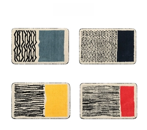 Detailed grid view of assorted striped bathroom mats with geometric non-slip patterns