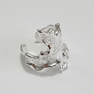 Minimalist 925 sterling silver ring with irregular liquid lava texture and open design