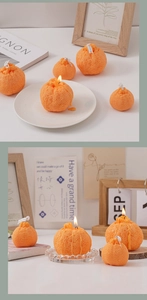 Detalle de velas aromáticas con forma de naranja con textura realista y mecha