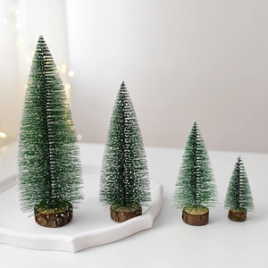Set of 4 mini flocked Christmas trees with natural wood bases for tabletop decoration