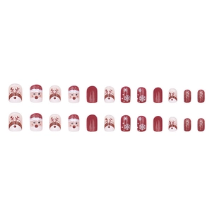 Christmas press-on nails set featuring 24 pieces with reindeer, snowflake and glitter designs