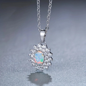 Elegant opal sunflower pendant necklace with zircon halo on silver chain and mirror reflection