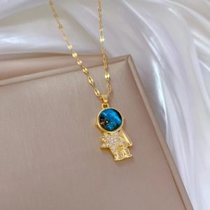 Golden astronaut necklace with starry blue helmet and sparkling crystal star pendant