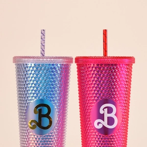 Reusable Tritan straw studded tumblers set in vibrant blue and pink colors with B logo