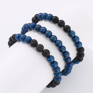 Detailed macro of 8mm agate beads and lava stones in a three-piece bracelet set