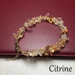 Close-up of natural Citrine gemstone chip bracelet with adjustable gold clasp