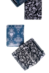 Close-up of gothic skull and floral prints on high-quality synthetic leather wallets
