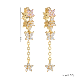 Detail view of floral tassel earrings with dimensions 32.3mm length and 13mm width