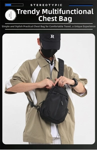 Detail of waterproof black nylon chest bag with adjustable strap and multiple zip pockets