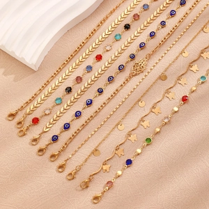 Detail of 8pcs golden evil eye anklet set with butterfly and crystal charms
