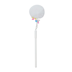 Detail of white unicorn gel pen with a soft fluffy pompom and colorful silicone charm