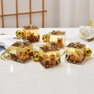 Set of creative Capybara quicksand keychains with floating glitter and gold metal rings