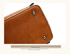 Detail view of brown oil-wax leather bag bottom with protective metal rivets