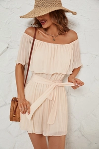Detail of off-white pleated off-the-shoulder romper with ruffled neckline and waist tie