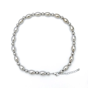Detail of silver beaded necklace with oval beads, lobster clasp and adjustable extension chain