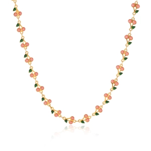 Detail of gold chain necklace featuring multiple pink glitter cherries and green leaves