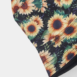 Detail of sunflower print pattern on black canvas fabric with fine stitching quality
