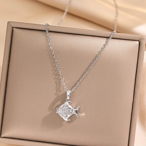 Elegant silver fish pendant necklace with micro-set rhinestones in a luxury display box