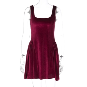 Detailed view of wine red velvet fabric texture and pleated waist on a sleeveless dress